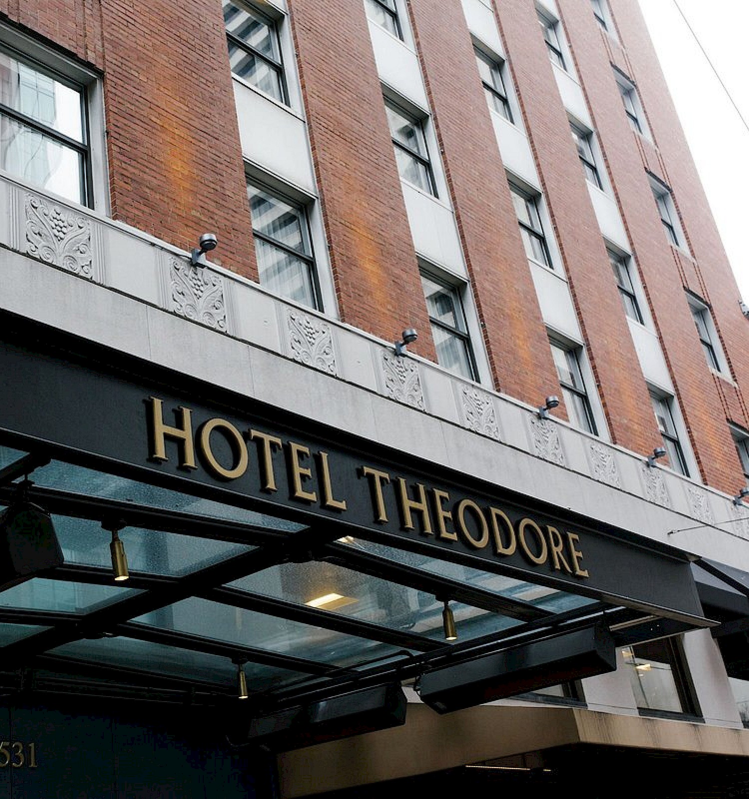 The image shows the entrance of a building with a sign that reads 